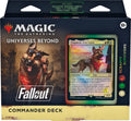 Top-down view of a colorful card game commander deck box and illustrated booster-style cards fanned on a dark tabletop