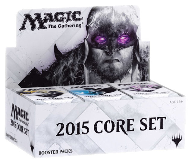 Closed cardboard booster box with colorful fantasy card art on the lid, stacked on a neutral surface