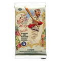 Assorted 2019 baseball cards fanned out over a wooden surface showing colorful player images and stats